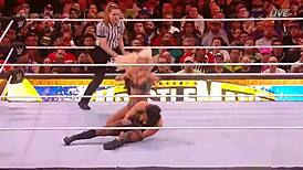 rhea ripley battles charlotte flair in a intense wrestling match at wrestlemania