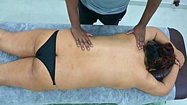 latina receives massage from black boy