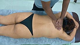 latina receives massage from black boy