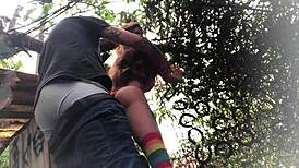 In the backyard, fucking the redhead's ass like a sex toy.