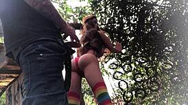 In the backyard, fucking the redhead's ass like a sex toy.