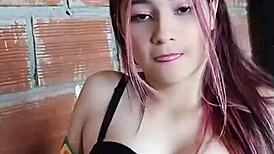 University student playfully teases her full breasts in a homemade video.