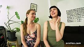 Girls kissing and licking outdoors in hallway