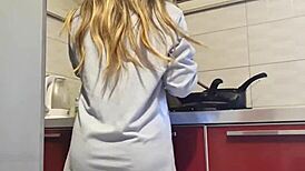 Hot girl cleans the stove, shows her big ass and tits, then masturbates passionately