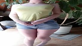 Fit girl strips panties revealing round ass