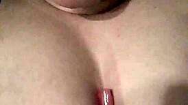 Sucking A Lollipop While Playing With Tits