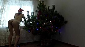bitch dancing around the christmas tree showing tits and ass