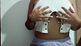 Milf massages her big natural tits with pleasure in a real homemade video