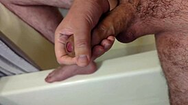 guy masturbates in the bathroom before jumping into the shower