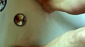 washing dirty feet in the bathtub