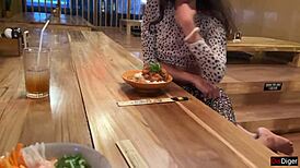Girl Eats Sushi Rolls In Public Bar