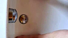 washing dirty feet in the bathtub