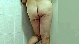 trans woman in crossdressing shows off barefoot feet and sexy ass