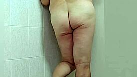 trans woman in crossdressing shows off barefoot feet and sexy ass