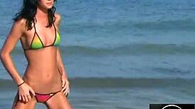 jessica dances sensually in bikini on beach, teasing with erotic moves