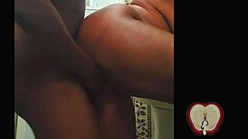 Ebony woman enjoys a vigorous session in the bedroom.