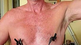 Pervy guy's nipples are wired to his cock for arousal