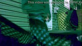 Watch the time lapse of a skinny woman stretching against steps at night, highlighting her legs and ass in leggings!