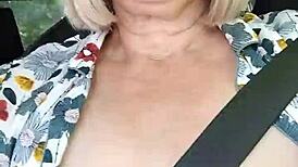 Naughty housewife takes homemade selfie with exposed tits in the car.