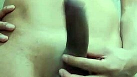 Hey, watch this shy guy masturbating his big cock in the bathroom