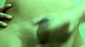 Hey, watch this shy guy masturbating his big cock in the bathroom