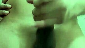 Hey, watch this shy guy masturbating his big cock in the bathroom