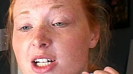 after double penetration, this redhead gets a bukkake over her face, wow!
