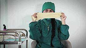 nurse in hospital uses latex gloves for fetish play