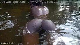 do you want to watch this skinny african girl bathing outdoors?