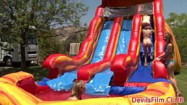 Lesbian Beauties Toying Each Other's Pussies with Dildos Outdoors