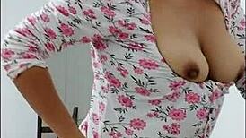 Milf with a beautiful ass dances showing it and showing her big nipples