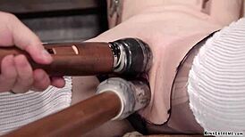 this bound blonde in woolen stockings gets roughly fucked with a dildo