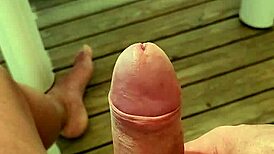Solo guy masturbates monster cock near orgasm on terrace