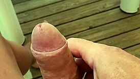 Solo guy masturbates monster cock near orgasm on terrace