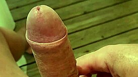 Solo guy masturbates monster cock near orgasm on terrace