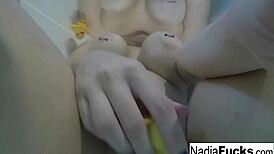 sexy nadia bathes with rubber duckies fingering her pussy