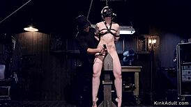 Blonde slave gets caned in doggy bondage