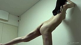 akane iruma tries on a pink leotard and socks during workout