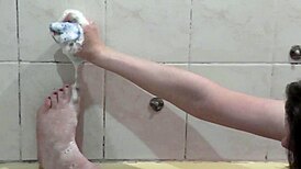 Girl takes relaxing bath with foam