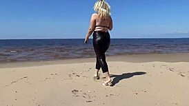 Big Leather Ass Walks on Beach in Heels