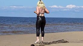 Big Leather Ass Walks on Beach in Heels