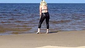 Big Leather Ass Walks on Beach in Heels