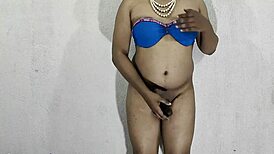 Indian shemale crossdresses in blue bikini solo