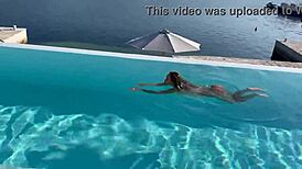 Gorgeous Monika Fox swims naked in pool at beautiful place