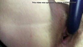 The vibrator fucks this vixen's trimmed pussy in the bedroom