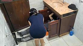 Wife seductively receives the plumber in the bathroom