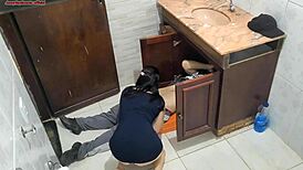 Wife seductively receives the plumber in the bathroom
