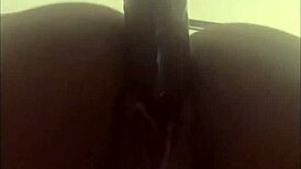 Wet ebony pussy gets fucked hard by a big dildo in solo play.