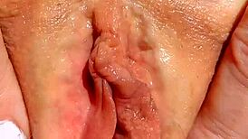 mature wife spreading shaved pussy for close-up massage