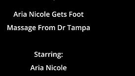 aria nicole lies back as doctor tampa massages her tattooed feet toes and soles close-up on beat2feet